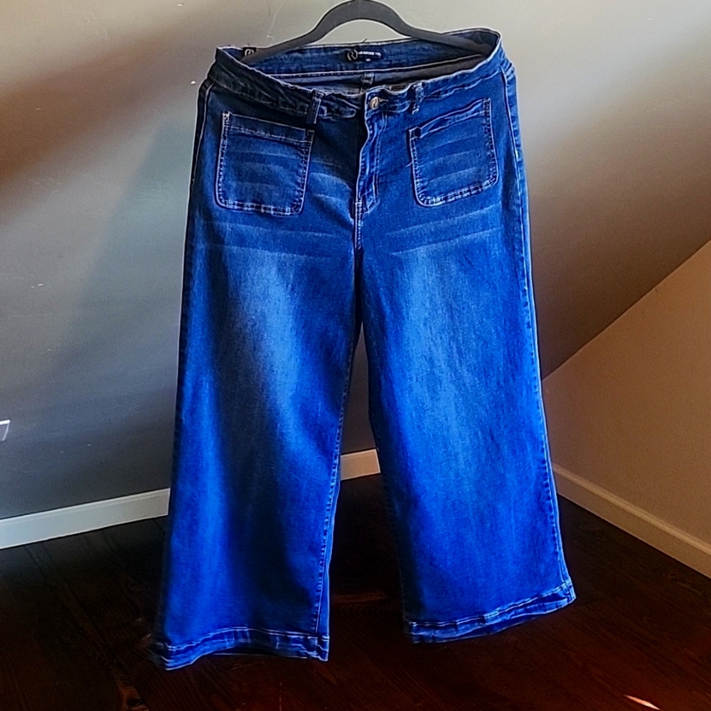 Denim blue jeans.  High waisted. Length comes just above your ankles.